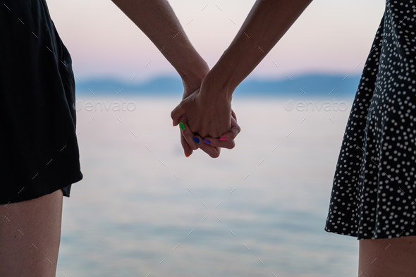 Closeup View Of Lesbian Gay Couple Holding Hands Stock Photo By Gajus Images